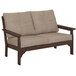 A POLYWOOD Vineyard mahogany settee with beige cushions.