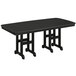 A black POLYWOOD outdoor dining table with legs.