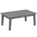 A POLYWOOD Lakeside slate grey rectangular coffee table with wooden legs on an outdoor patio.