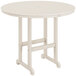 A white round POLYWOOD bar height table on a patio.
