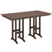 A mahogany POLYWOOD bar height table on an outdoor patio with two legs.