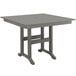 A POLYWOOD slate gray square dining height table on an outdoor patio.