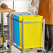 A yellow 10-gallon ingredient bin with a lid, designed for kitchen storage and organization.