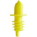 A yellow plastic liquor pourer with a white background.