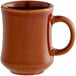 A close-up of a brown Acopa stoneware coffee mug with a handle.