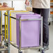 A purple 10-gallon ingredient bin on a metal cart, designed for allergen-free storage.