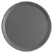 A gray round non-skid serving tray.