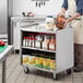 Regency 21" x 33" Three Shelf 18-Gauge Stainless Steel Utility Cart with Enclosed Base and Open Front Main Thumbnail 1