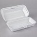 A white foam container with a hinged lid.