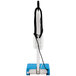 A blue and white Namco Floorwash 5000 walk behind cylindrical floor scrubber with a cord and handle.
