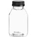 A clear plastic 8 oz. square juice bottle with a black lid.