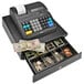 A Royal cash register with paper money in the drawer.