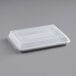 A white plastic container with a rectangular lid.