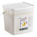 A white plastic bucket of Les Vergers Boiron Banana 100% Fruit Puree with a label.