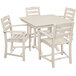 A POLYWOOD white table and chairs set with four white chairs.