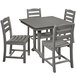 A POLYWOOD grey farmhouse dining table with four matching chairs on an outdoor patio.