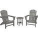 A POLYWOOD slate grey patio set with three Adirondack chairs and a round table on an outdoor patio.