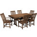A POLYWOOD teak dining table with chairs on an outdoor patio.