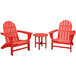 A group of red POLYWOOD Adirondack chairs and a round table on an outdoor patio.