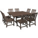 A POLYWOOD mahogany rectangular table with chairs on an outdoor patio.