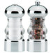 A Chef Specialties Lori acrylic and chrome pepper mill and salt shaker set with pepper and salt in them.