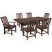 A POLYWOOD mahogany dining table with six chairs on an outdoor patio.