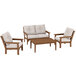 A POLYWOOD deep seating patio set with 2 chairs, a couch, and a wood table.
