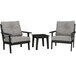 A POLYWOOD Lakeside table and chairs set with black and grey chairs.