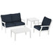 White POLYWOOD patio chair, settee, and table with blue cushions.