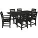 A black POLYWOOD farmhouse table with six chairs on an outdoor patio.