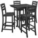 A black POLYWOOD outdoor bar table with four chairs.