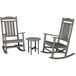 A grey POLYWOOD rocking chair and table set.