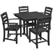 A POLYWOOD black farmhouse table and four chairs on an outdoor patio.