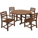 A POLYWOOD teak table with 2 arm chairs and 2 side chairs on an outdoor patio.