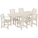 A POLYWOOD white La Casa Cafe dining set with a Nautical table and six chairs on an outdoor patio.