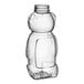 A clear plastic 16 oz. Bear PET honey bottle with a white lid.