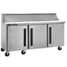 A Traulsen stainless steel sandwich prep table with three right hinged doors.