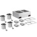 A ServIt countertop food cooker/warmer with adapter plates and four inset pots on a counter.