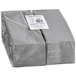 A stack of Hoffmaster FashnPoint slate gray dinner napkins in plastic wrap on a white background.