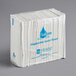 A stack of Hoffmaster white Flusheeze disposable guest towels.
