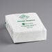 A stack of white Hoffmaster Linen-Like dinner napkins with green text on the packaging.