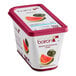A container of Les Vergers Boiron frozen watermelon puree with a slice of watermelon.