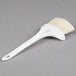 A white Winco pastry/basting brush with a white handle.
