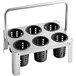 A stainless steel flatware carrier with 6 black plastic perforated cylinders on it.