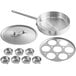 A stainless steel egg poacher pan with cups and a lid.