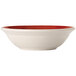 A close up of a Libbey Basics white melamine bowl with a red rim.