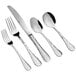 An Acopa Inspira stainless steel flatware set with a fork, spoon, and knife.