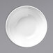 A Libbey Basics bright white melamine bowl on a gray surface.