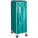 A green vinyl Curtron bun pan rack cover on a storage cart with wheels.