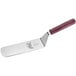 A Mercer Culinary Hell's Handle® solid beveled edge turner with a red handle.